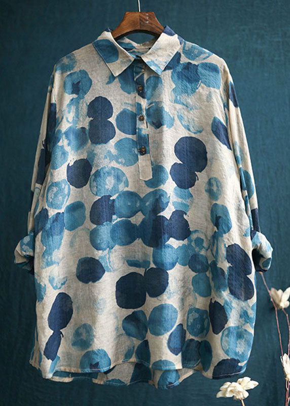 Blue and beige floral patterned shirt on a hanger against a dark blue background