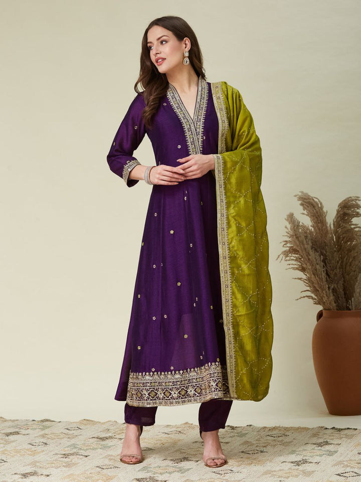 Purple Roman Silk embroidered Anarkali set with matching pants and contrast green dupatta.