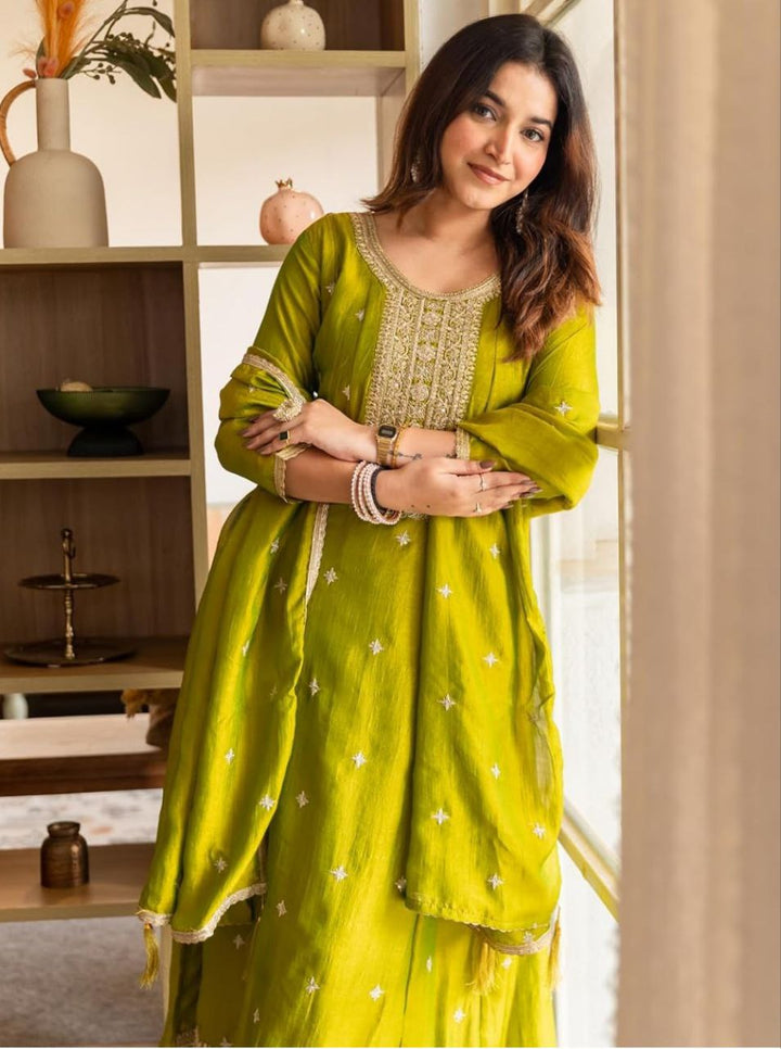 Close-up of the olive-green Anarkali kurta neckline showing detailed golden embroidery.