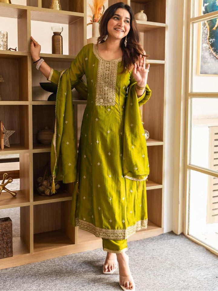 Fabric texture of the olive-green embroidered Anarkali set showing fine weave and thread work.